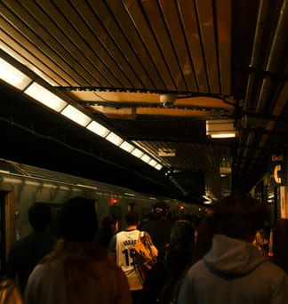 Commuters crowding a Toronto station platform.